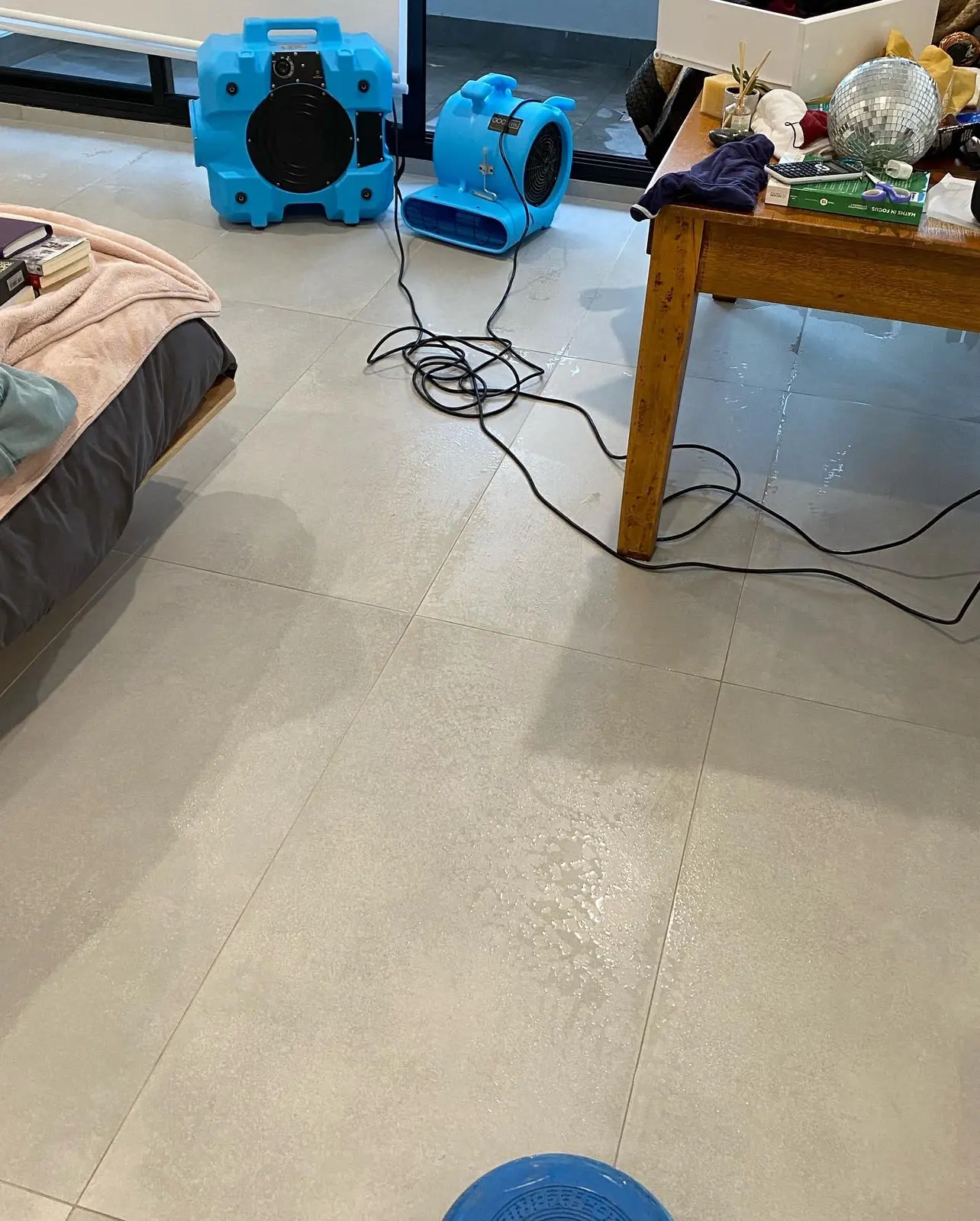 Air movers positioned for structural drying inside a residential property
